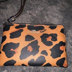 Authentic Coach, like new, animal print wristlet/wallet